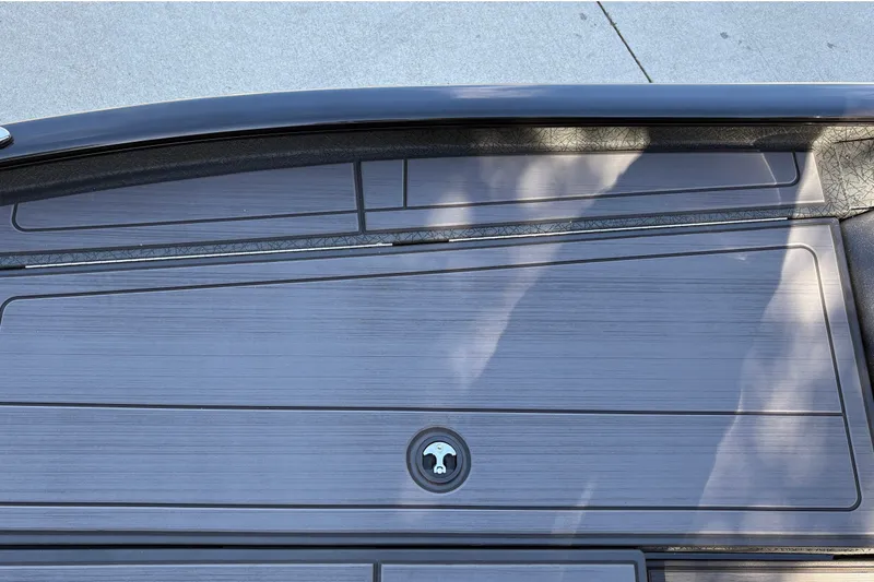 Slide: The Image of 2027 Tracker Savage 215 boat deck with sleek, modern design and secure storage compartment. - 37
