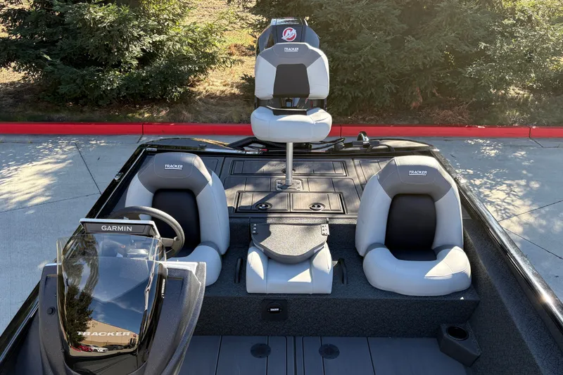 Slide: The Image of 2027 Tracker Savage 215 boat interior with Garmin system and comfortable seating. - 19
