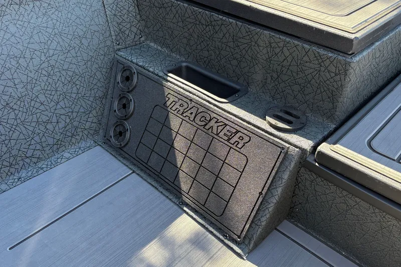 Slide: The Image of 2027 Tracker Savage 215 boat interior with textured design and branded panel. - 30