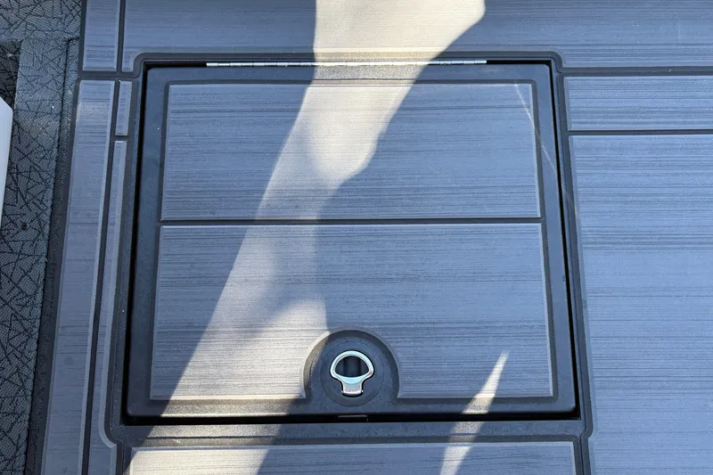 Slide: The Image of Hatch on 2027 Tracker Savage 215 boat deck, featuring sleek design and secure latch. - 25