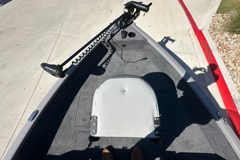 Slide: The Image of 2027 Tracker Pro Guide V-16 WT boat interior with trolling motor and seating. - 18