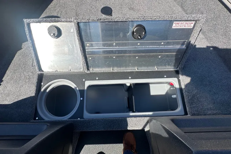 Slide: The Image of 2027 Tracker Pro Guide V-16 WT boat storage compartments with pump-out feature. - 17