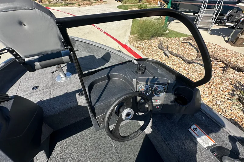 Slide: The Image of 2027 Tracker Pro Guide V-16 WT boat interior with steering wheel and dashboard controls. - 20