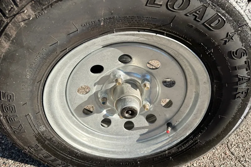 Slide: The Image of Trailer wheel with Loadstar tire for 2027 Mako Pro Skiff 15 CC boat. - 60