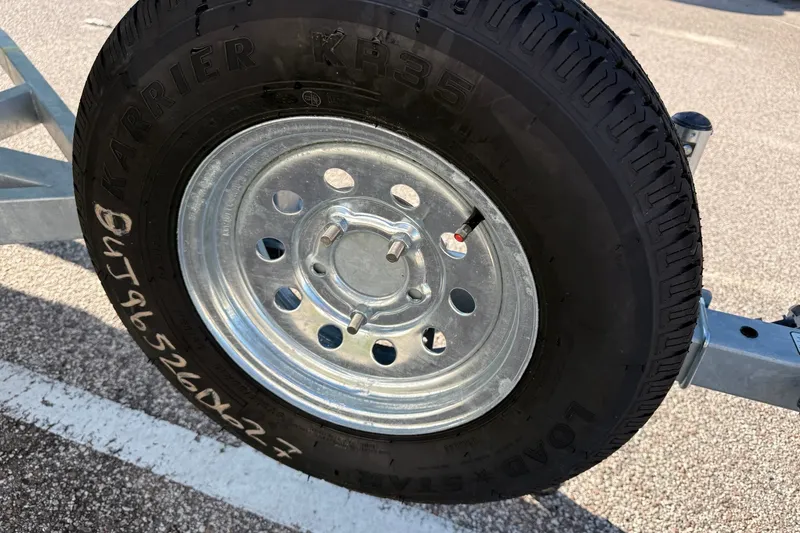 Slide: The Image of Trailer wheel with Karrier KR35 tire, Mako Pro Skiff 15 CC 2027 model. - 6