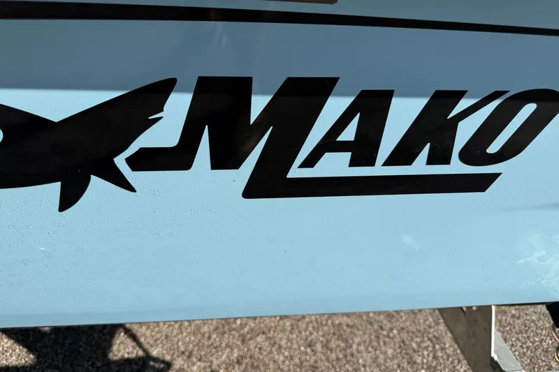 Slide: The Image of 2027 Mako Pro Skiff 15 CC logo on boat hull, featuring bold black lettering. - 3