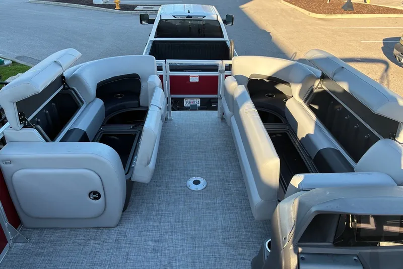 Slide: The Image of 2026 Sun Tracker SportFish 22 DLX interior with spacious seating and storage compartments. - 15