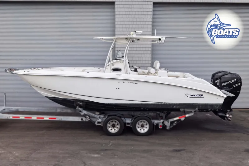 The Image of 2006 Boston Whaler 270 Outrage boat on trailer, side view, with twin Mercury engines. - 0