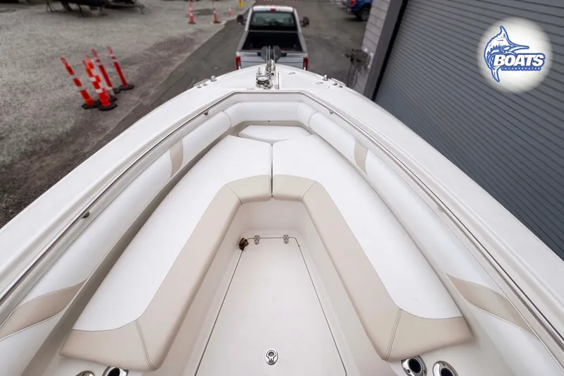 Slide: The Image of 2006 Boston Whaler 270 Outrage boat interior with cushioned seating and storage. - 4