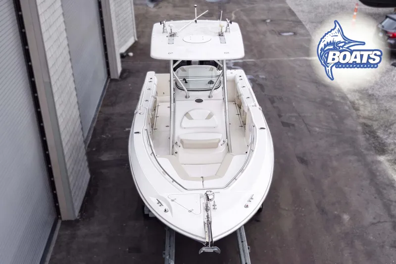 Slide: The Image of 2006 Boston Whaler 270 Outrage boat in a storage facility, top view. - 3