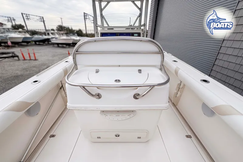 Slide: The Image of 2006 Boston Whaler 270 Outrage boat interior with storage compartment and seating. - 8