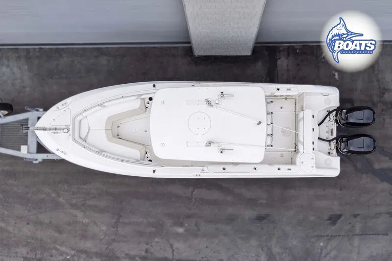 Slide: The Image of Aerial view of a 2006 Boston Whaler 270 Outrage boat on a trailer. - 13