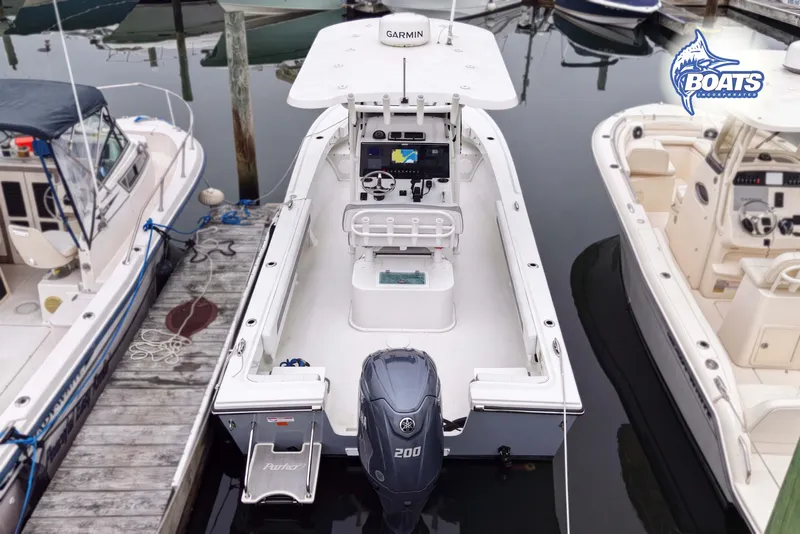Slide: The Image of 2024 Parker 2300 Special Edition boat docked, featuring Garmin electronics and Yamaha 200 engine. - 12