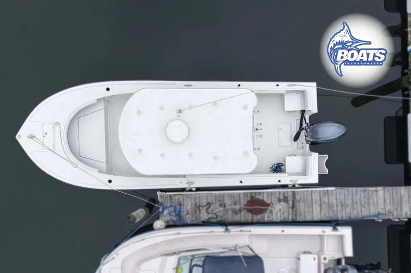 Slide: The Image of Top view of a 2024 Parker 2300 Special Edition boat docked at a marina. - 11