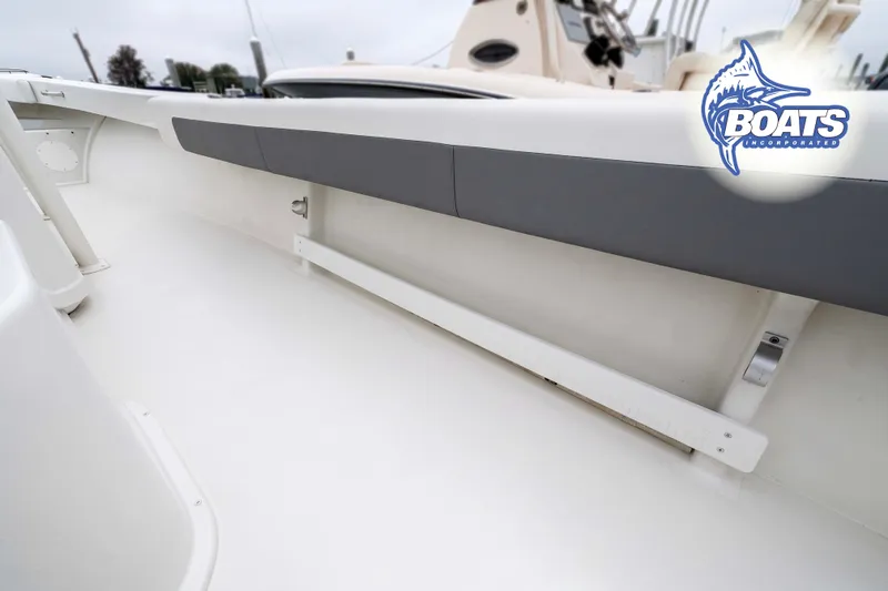 Slide: The Image of 2024 Parker 2300 Special Edition boat interior with cushioned seating and sleek design. - 6