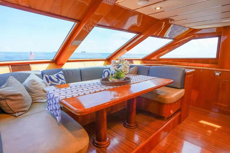 Slide: The Image of Luxurious interior of 2001 Monte Fino 82MY yacht with elegant wood finish and ocean view. - 30