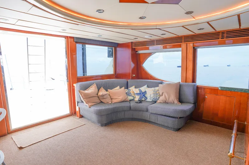 Slide: The Image of Luxurious Monte Fino 82MY yacht interior with plush seating and ocean view, 2001 model. - 33