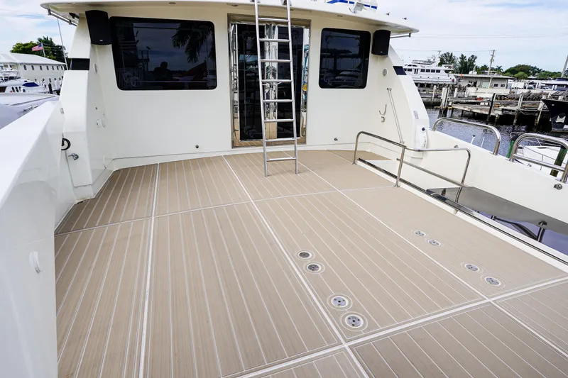 Slide: The Image of Monte Fino 82MY 2001 yacht deck with ladder and railing, docked at marina. - 18
