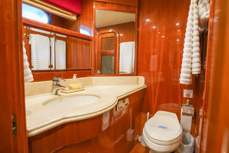 Slide: The Image of Luxurious bathroom on 2001 Monte Fino 82MY yacht with elegant wood finish and modern amenities. - 42