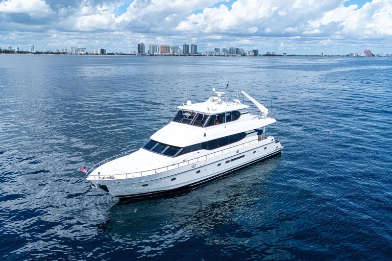 Slide: The Image of Luxurious 2001 Monte Fino 82MY yacht cruising on open water under a cloudy sky. - 3