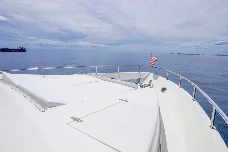 Slide: The Image of Bow view of 2001 Monte Fino 82MY yacht with ocean and skyline in background. - 9
