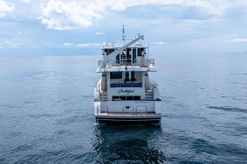 Slide: The Image of Monte Fino 82MY yacht from 2001 on calm ocean waters under a cloudy sky. - 6