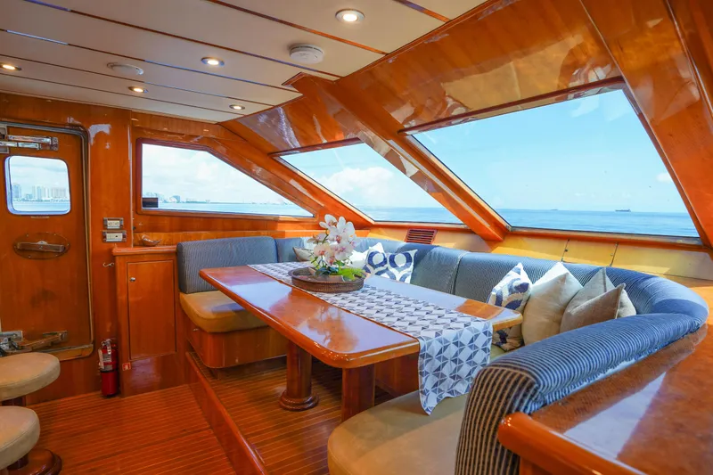 Slide: The Image of Luxurious interior of 2001 Monte Fino 82MY yacht with ocean view and elegant seating. - 26