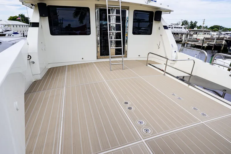 Slide: The Image of Spacious deck of 2001 Monte Fino 82MY yacht with ladder and railing. - 19