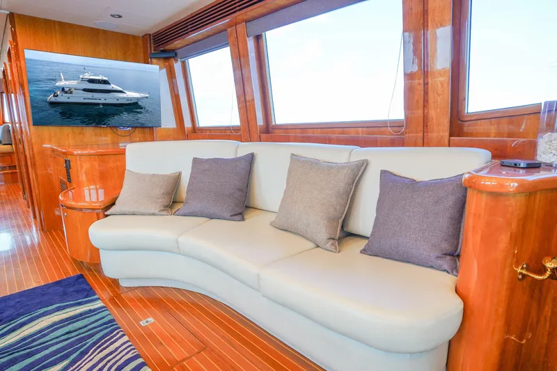 Slide: The Image of Luxurious interior of 2001 Monte Fino 82MY yacht with plush seating and elegant wood finishes. - 23