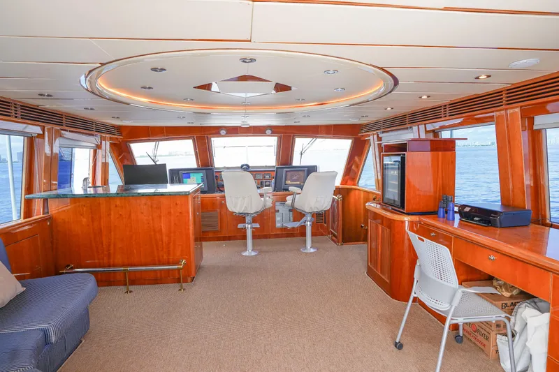 Slide: The Image of Luxurious interior of 2001 Monte Fino 82MY yacht with panoramic windows and elegant wood finish. - 34