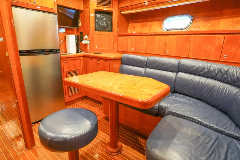 Slide: The Image of Luxurious interior of 2001 Monte Fino 82MY yacht with wood paneling and leather seating. - 48