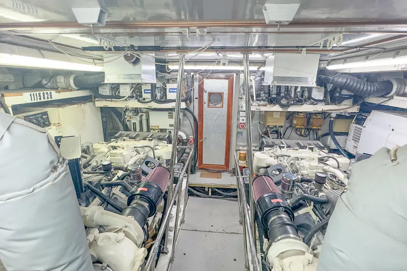 Slide: The Image of Engine room of 2001 Monte Fino 82MY yacht, showcasing machinery and equipment. - 52