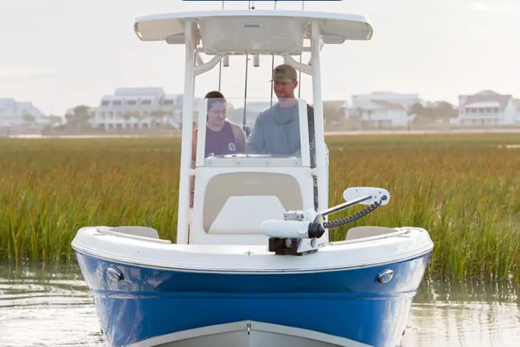 Slide: The Image of Manufacturer Provided Image: 2019 Stingray 236 CC boat cruising in a marshland area. - 25
