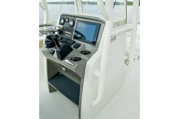 Slide: The Image of Manufacturer Provided Image: 2019 Stingray 236 CC boat console with steering wheel and navigation system. - 29