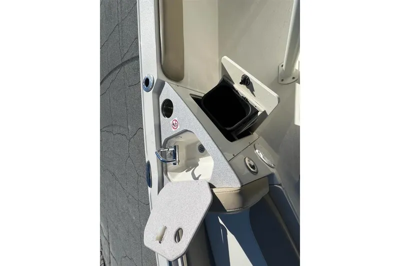 Slide: The Image of 2019 Stingray 236 CC boat interior detail with open storage compartment. - 18