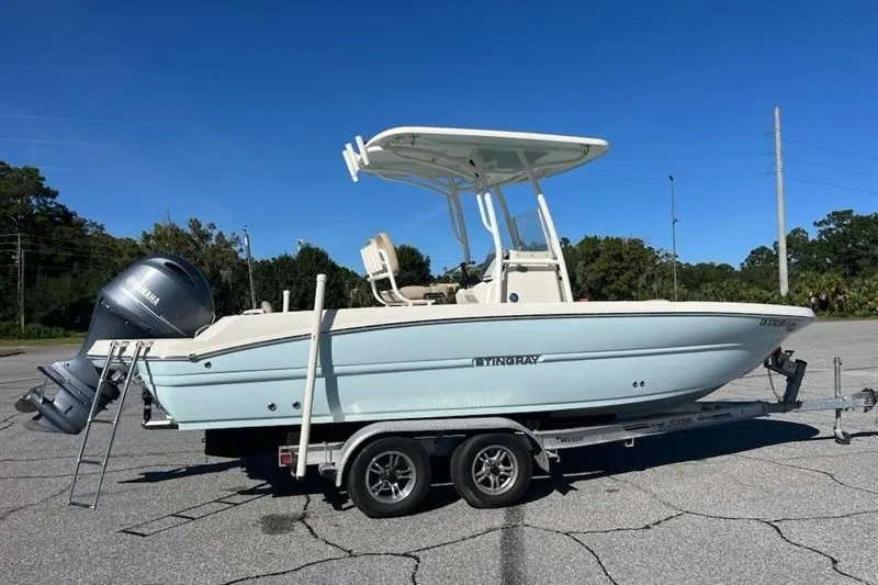 Slide: The Image of 2019 Stingray 236 CC boat on trailer with Yamaha outboard motor. - 3