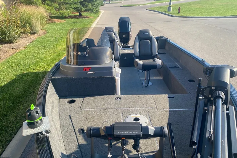 Slide: The Image of 2014 Lund 1650 Rebel XL SS fishing boat with Garmin equipment, parked on a sunny day. - 9