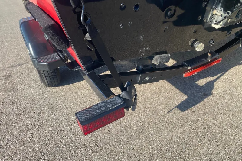 Slide: The Image of Rear view of a 2014 Lund 1650 Rebel XL SS boat trailer with red tail light. - 8