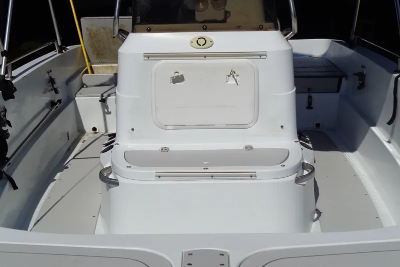 Slide: The Image of 2004 Triumph 190 Bay boat interior with seating and storage compartments. - 5