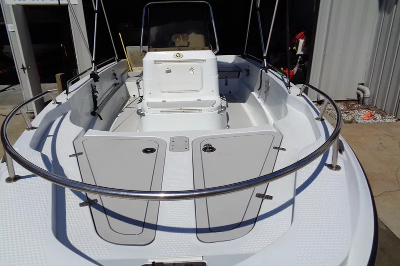 Slide: The Image of 2004 Triumph 190 Bay boat interior with open deck and storage compartments. - 6