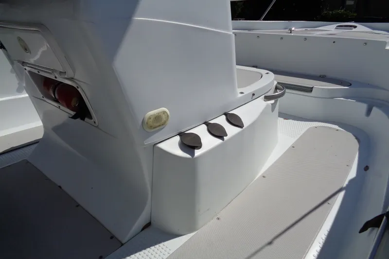 Slide: The Image of 2004 Triumph 190 Bay boat interior with seating and storage compartments. - 18