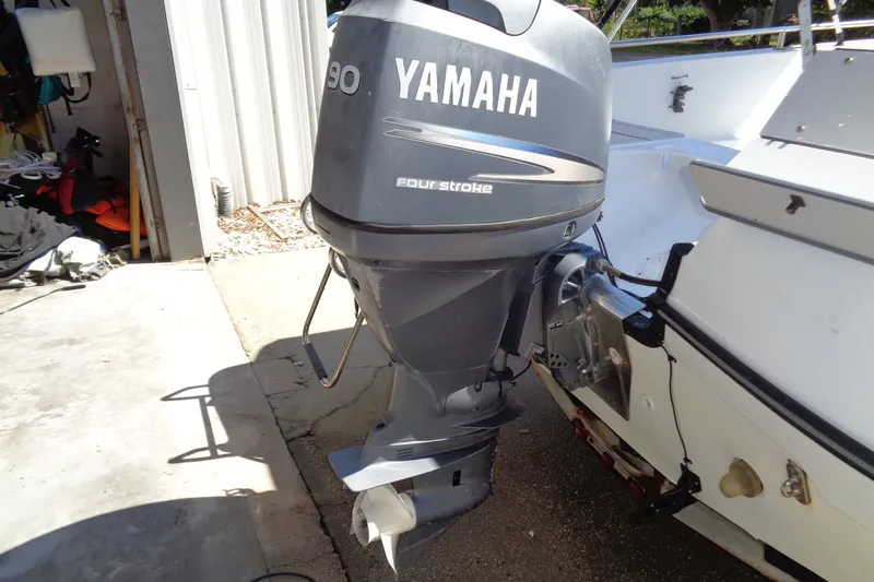 Slide: The Image of 2004 Triumph 190 Bay boat with Yamaha 90 horsepower four-stroke outboard motor. - 13