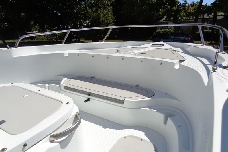Slide: The Image of 2004 Triumph 190 Bay boat interior with seating and storage compartments. - 8