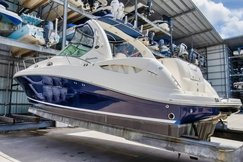 Slide: The Image of 2005 Sea Ray 340 Sundancer boat in storage facility, side view. - 4