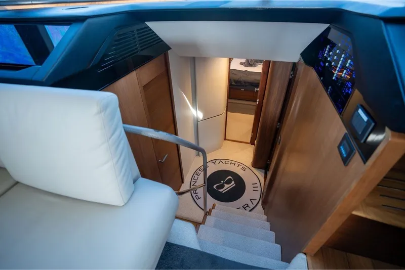 Slide: The Image of Interior of 2021 Princess S66 yacht, featuring luxurious staircase and modern design elements. - 25