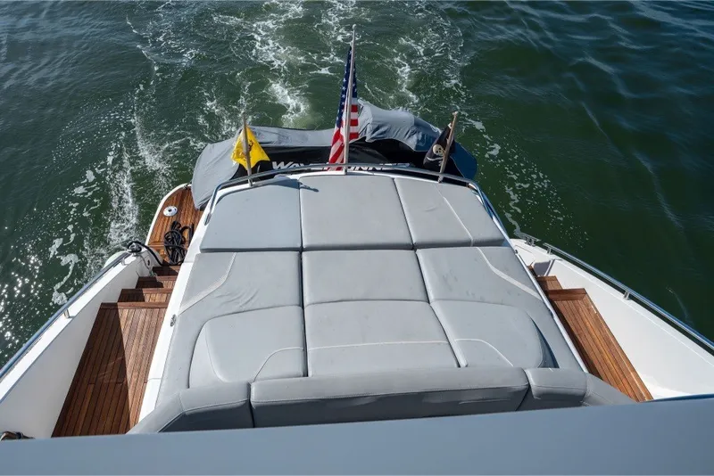 Slide: The Image of Luxury Princess S66 yacht deck with sunbed, cruising on open water, 2021 model. - 15