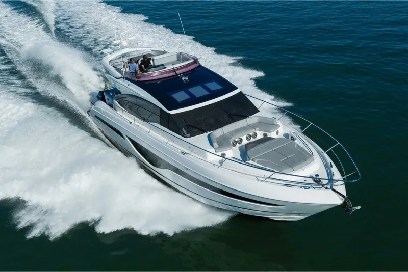 Slide: The Image of Luxury 2021 Princess S66 yacht cruising on open water, showcasing sleek design and performance. - 7