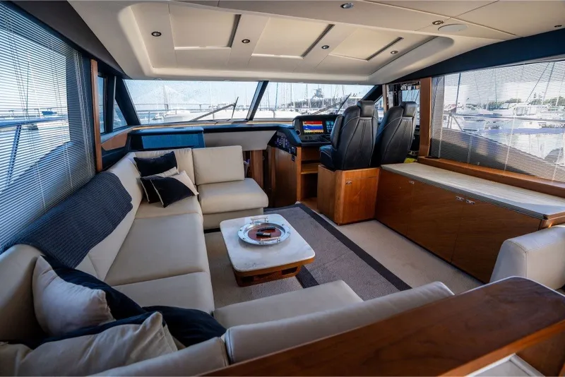 Slide: The Image of Luxurious interior of a 2021 Princess S66 yacht with elegant seating and modern helm. - 21