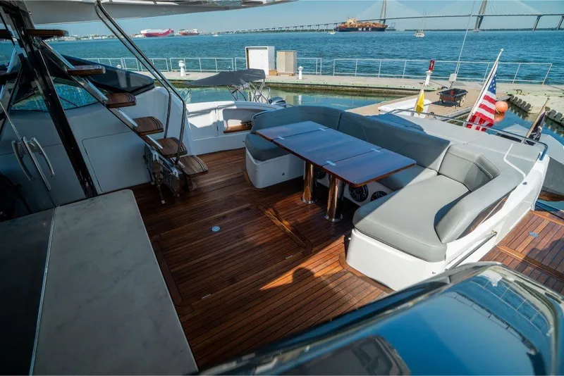 Slide: The Image of Luxurious 2021 Princess S66 yacht deck with elegant seating and ocean view. - 16
