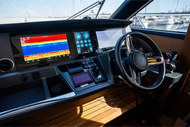Slide: The Image of Cockpit of 2021 Princess S66 yacht with advanced navigation displays and steering wheel. - 4